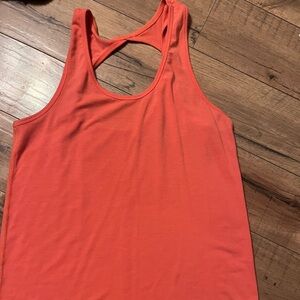 EUC Zyia workout tank top. Dark peach color/salmon color. Size small